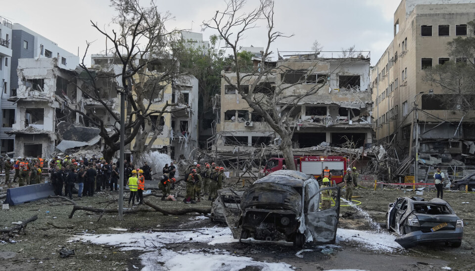 Rescue team work at the site where a missile launched from Iran struck Tel Aviv, Israel, Monday, June 16, 2025. (AP Photo/Baz Ratner)